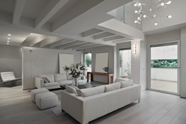 interior of a modern living room with wood floor in foregorund the sofa